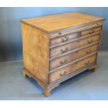 A 20th Century Chest, the moulded top above a brushing slide and two short and three long drawers