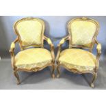 A Pair of French Gilded Fauteuils each with a partly upholstered and carved back above a stuff