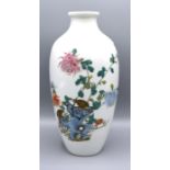 A Chinese Porcelain Oviform Vase decorated in polychrome enamels with birds amongst foliage, red
