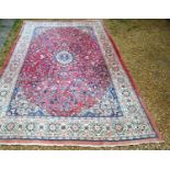 A North West Persian Large Carpet, with a central medallion within an all over design upon a red,