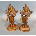 A Pair of Chinese Patinated Bronze Figures each with coral inset, 16 cms tall