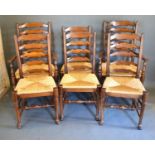 A Set of Six Reproduction Oak Ladder Back Dining Chairs to match the previous lot with removal