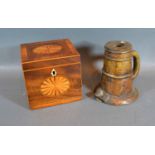 A 19th Century Mahogany Shell Inlaid Tea Caddy together with an early patinated bronze candlestick