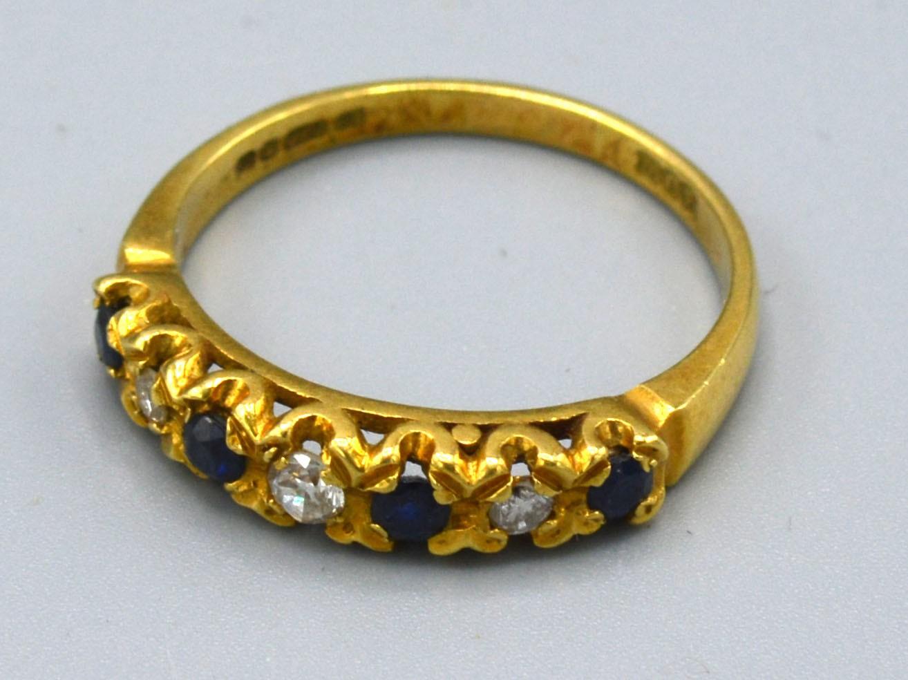 An 18ct. Gold Diamond and Sapphire Half Eternity Ring, 3.8 gms, ring size Q