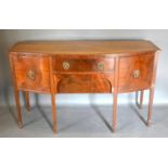 A Early 20th Century Mahogany Bow-Fronted Sideboard with two central drawers flanked by cupboard
