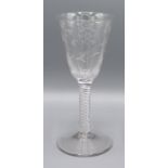 A Jacobite Style Wine Glass engraved with flowers and with twisted stem and circular foot, 17 cms