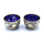 A Pair of Chinese White Metal Salts with blue glass liners