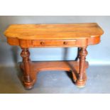 A Victorian Mahogany Side Table, the moulded shaped top above a frieze drawer raised upon turned