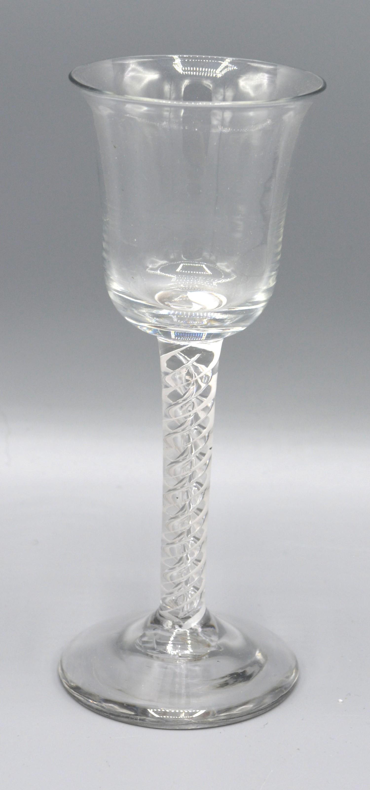 An Early Cordial Glass Mixed Air and Cotton Twist and with circular foot, 15 cms tall