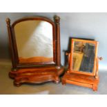 A Victorian Mahogany Swing Frame Dressing Table Mirror, the arched mirror with turned tapering
