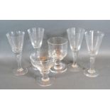 A Set of Four Glass Champagne Flutes together with two early rummers