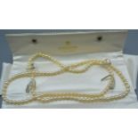 A String of Cultured Pearls within Mikimoto case, approximately 90 cms long