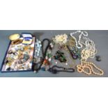 A Collection of Costume Jewellery to include bead necklaces, brooches and other items