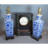 A Victorian Black Slate Mantle Clock together with a pair of Chinese underglaze blue decorated table