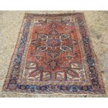 A North West Persian Woollen Large Rug with a central medallion within an all over design upon a