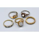 A 9ct. Gold Dress Ring set with oval moon stone together with two other 9ct. gold dress rings, a