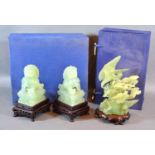 A Chinese Jade Carving with hardwood stand and fitted box together with another similar pair of
