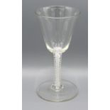 An Early Wine Glass with tapering bowl above a cotton twist stem and circular foot, 17 cms tall