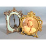 An Art Nouveau Style Gilt Metal Photograph Frame together with another similar, 21 and 25 cms tall