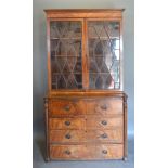 A Regency Mahogany Secretaire Bookcase, the moulded cornice above a pair of astragal glazed doors