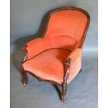 A Victorian Carved Walnut Drawing Room Armchair, the shaped back above a stuff-over seat with scroll