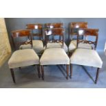 A Set of Six Regency Mahogany Rail Back Dining Chairs, the carved rail backs with brass inlays