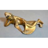 An Early Chinese Bronze Model in the form of a Reclining Figure, 19 cms long