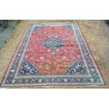 A North West Persian Woollen Large Carpet with a central medallion within an all over design upon