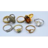 A 9ct. Gold and Silver Dress Ring together with seven other dress rings