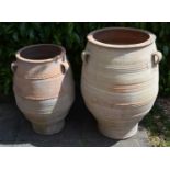 A Large Terracotta Garden Urn 93 cms tall together with another similar 79 cms tall