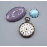 A Kensington Art Ware Ruskin Style Brooch together with an enamel set brooch and a silver cased