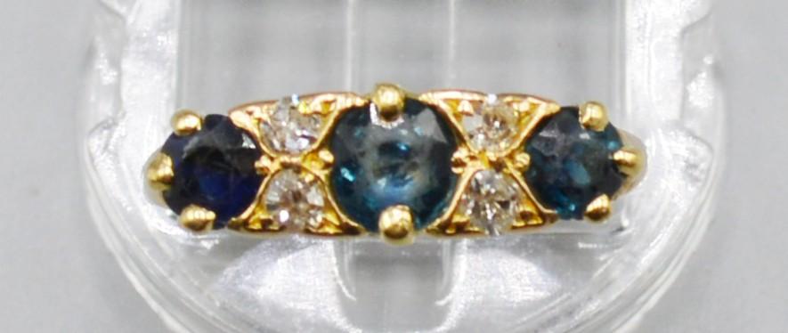 An 18ct Gold Sapphire And Diamond Ring, set with three Sapphire and four diamonds, 4 grams, ring - Image 2 of 2