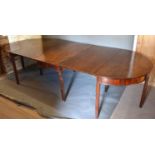 A 19th Century Mahogany Extending Dining Table with centre drop flap table and with a pair of demi-