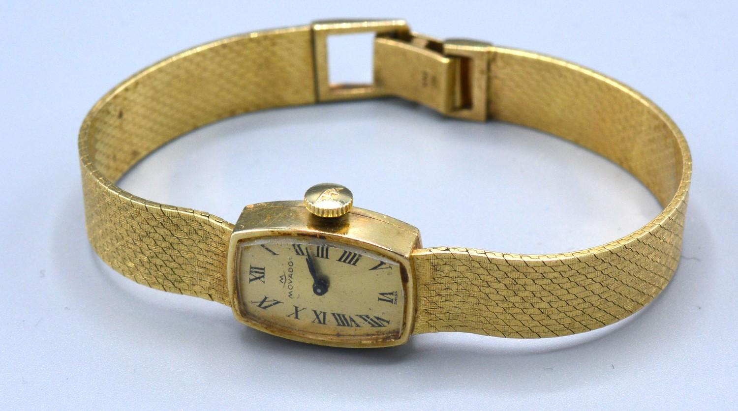 A 14ct Gold Cased Ladies Wrist Watch by Movado 19.2 gms excluding movement and glass