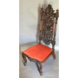 A 19th Century Anglo Indian Carved Rosewood Side Chair, the pierced back above the drop in seat