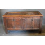 An 18th Century Oak Large Coffer converted to a Side Cabinet, the moulded top above two panel