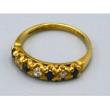 An 18ct. Gold Diamond and Sapphire Half Eternity Ring, 3.8 gms, ring size Q