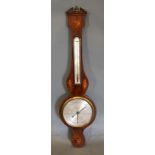 A 19th Century Mahogany Wheel Barometer Thermometer with shell and line inlays, the silvered dial