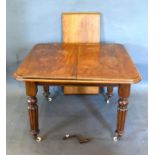 A Victorian Mahogany Wind-Out Extending Dining Table, the moulded top above a plain frieze raised