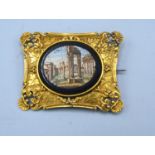 A 19th Century Oval Micro Mosaic Brooch depicting Roman ruins within a yellow metal frame, 4.5 x 3.5
