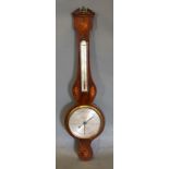 A 19th Century Mahogany Wheel Barometer Thermometer with shell and line inlays, the silvered dial