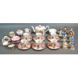 A Victorian Continental Tea Set decorated with figures amongst landscapes and highlighted in gilt