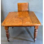 A Victorian Walnut Wind-out Extending Dining Table, the moulded top above a plain frieze raised upon