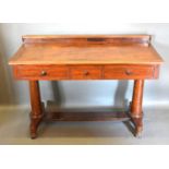 A 19th Century Mahogany Side Table with a low galleried back above three drawers with knob handles