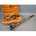 A Corton Clarinet within fitted case together with another clarinet by Vito