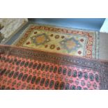 A Turkish Woollen Rug 180 x 120 cms together with a Bokhara woollen rug 260 x 184 cms
