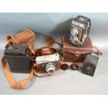 A Zeiss Ikon Ikoflex Camera with leather travel case together with a Voigtlander Bitoret Camera
