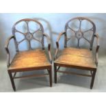 A Pair of Early 19th Century Chippendale Style Armchairs each with a pierced carved back above a