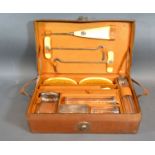 A Silver Mounted and Cut Glass Gentleman's Dressing Case complete with bottles, brushes and