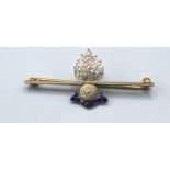 A Yellow Metal Royal Artillery Bar Brooch set with diamonds and blue enamel 4.5 cms long